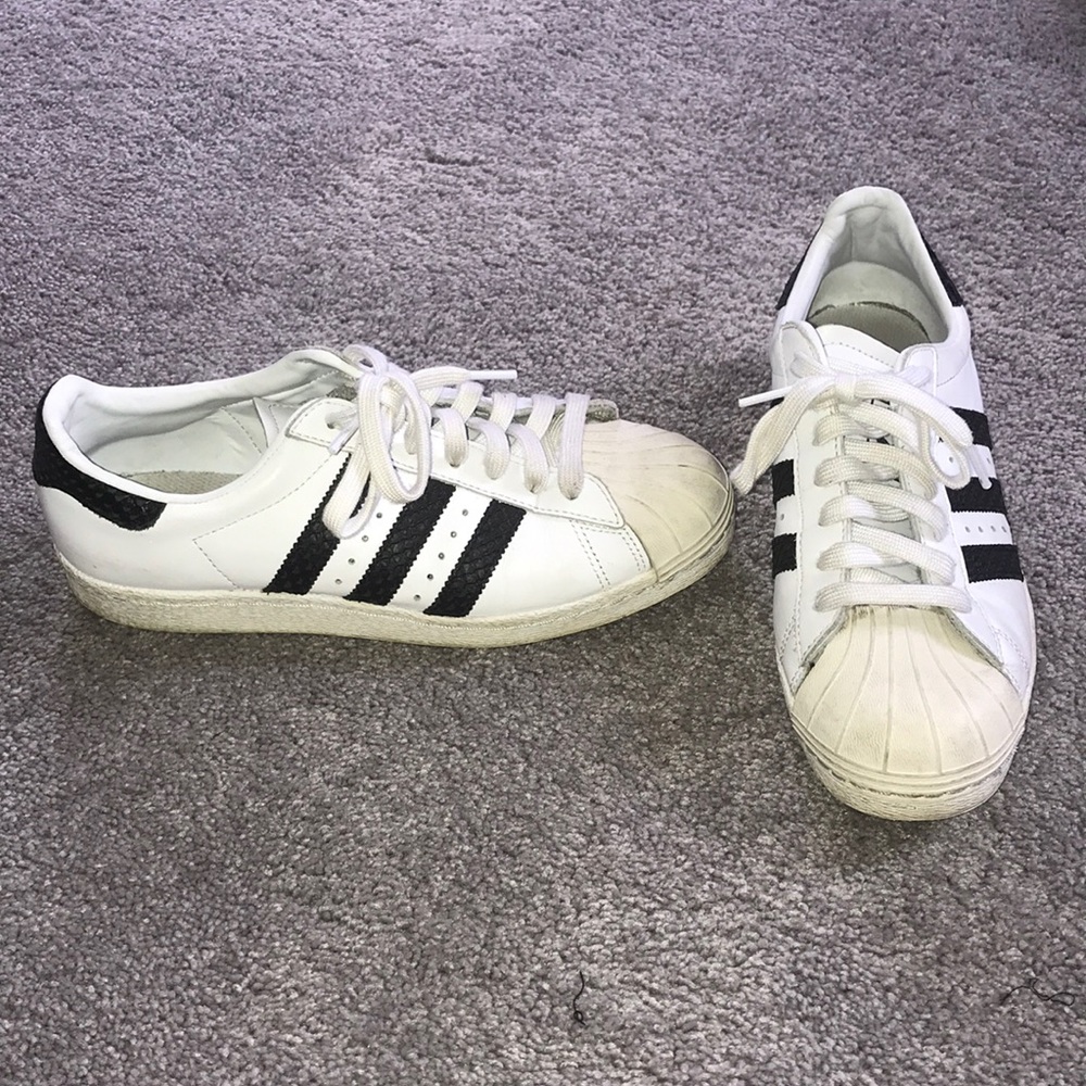 Adidas custom sneaker with black snakeskin stripes